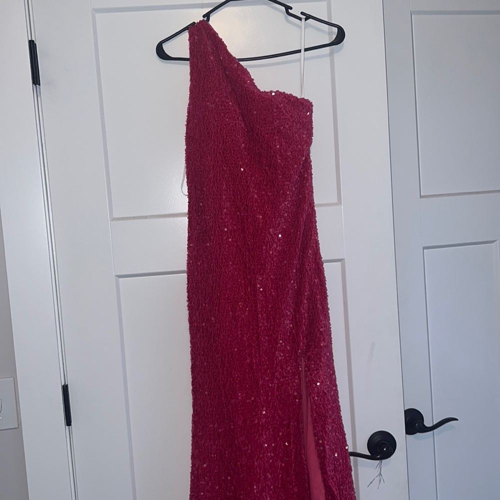 pink sparked prom dress with a designed back